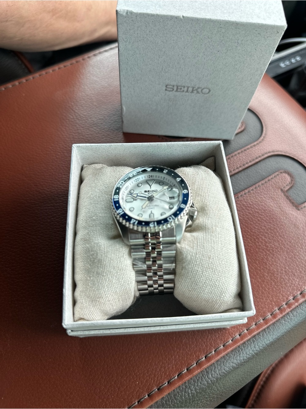 Seiko Silver Stainless Steel Watch with Blue Bezel and White Dial